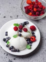 Vanilla ice cream sundae with fresh summer berries