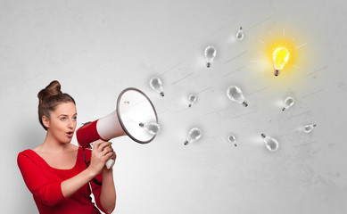 Person talking in megaphone with bulb, new idea concept