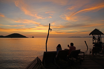 Fototapeta na wymiar beautiful sunset in the evening bridge silhouette relax beach at Koh Mak island Trat Thailand