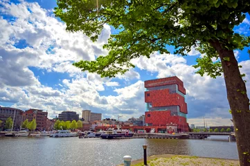  Antwerp, Belgium - April 26, 2019: Museum aan de Stroom (MAS) along the river Scheldt and the Port of Antwerp in Antwerp, Belgium. © Jbyard