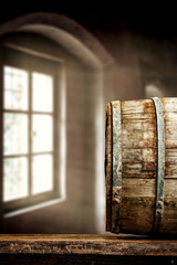 Old wooden barrel in a cellar