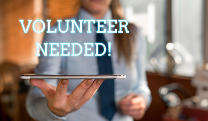 Word writing text Volunteer Needed. Business photo showcasing need work for organization without being paid Blurred woman in the background pointing with finger in empty space