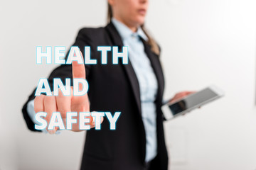 Conceptual hand writing showing Health And Safety question. Concept meaning regulations and procedures intended to prevent accident Digital business in black suite concept with business woman