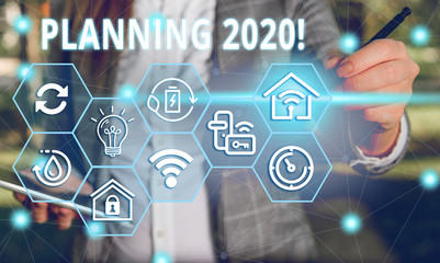 Word writing text Planning 2020. Business photo showcasing process of making plans for something next year Female human wear formal work suit presenting presentation use smart device