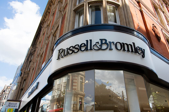 LONDON, UK - JULY 31th 2018: Russell and Bromley shoe shop store front branding on Oxford Street in central London.