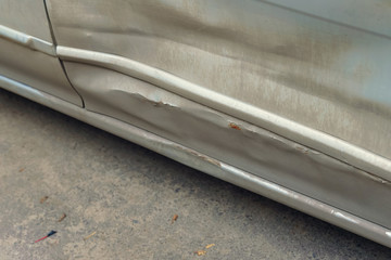 damaged car door after an accident