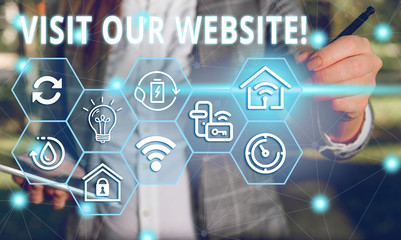 Word writing text Visit Our Website. Business photo showcasing visitor who arrives at web site and proceeds to browse Female human wear formal work suit presenting presentation use smart device