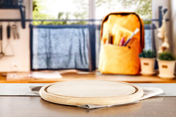 Fototapeta na wymiar Table background with yellow schoolbag on a windowsill in the school interior.
