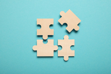 Wooden puzzles, solving problems in business. Innovation and teamwork in company.
