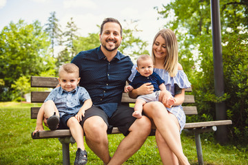 Happy family having fun resting in park