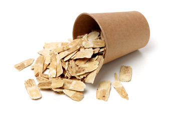 Chinese Herbal medicine - Astragalus slices, Huang Qi (Astragalus propinquus) on white background