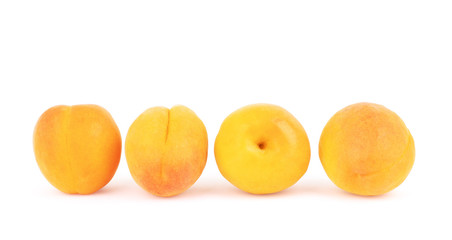 Apricot fruits with leaves isolated on white background