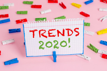 Writing note showing Trends 2020. Business concept for general direction in which something is developing or changing