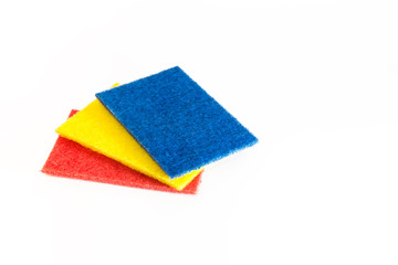 Assortment of cleaning facilities. Household goods. Sponges for washing dirty kitchen utensils, various napkins on a white background with copy space