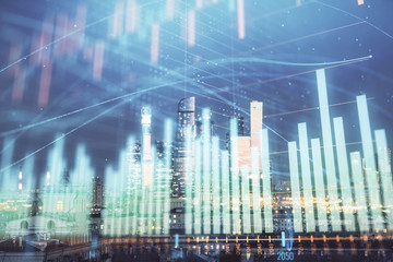 Double exposure of financial chart on Moscow city downtown background. Concept of stock market analysis