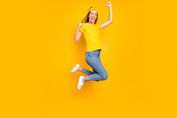 Fototapeta na wymiar Full length photo of beautiful lady jumping high celebrating first place wear casual clothes isolated yellow background