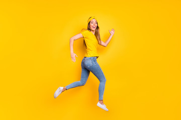 Fototapeta na wymiar Full body photo of beautiful lady jumping high jogging wear casual clothes isolated yellow background