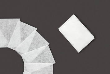 Lint-free wipes on dark background. Professional Nail Care Tools For Manicure. Varnish removal Small nail art and manicure business. Nail Polish and degreasing removal tool.