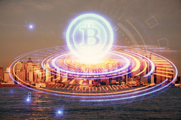 Double exposure of crypto currency theme hologram drawing and city veiw background. Concept of...