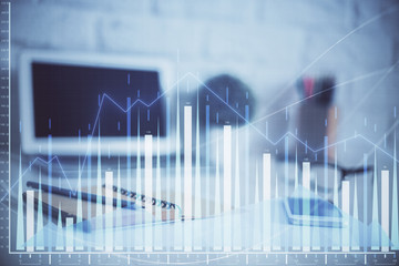 Forex Chart hologram on table with computer background. Multi exposure. Concept of financial markets.