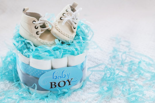 Present cake with diapers for newborn baby boy