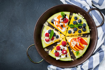 Watermelon pizza with berries, fruits, yogurt, feta cheese
