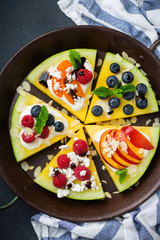 Watermelon pizza with berries, fruits, yogurt, feta cheese
