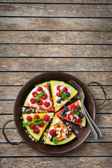 Watermelon pizza with berries, fruits, yogurt, feta cheese
