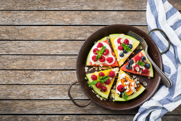 Watermelon pizza with berries, fruits, yogurt, feta cheese