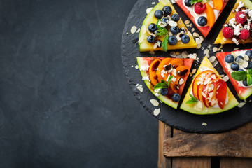 Watermelon pizza with berries, fruits, yogurt, feta cheese