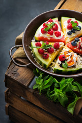 Watermelon pizza with berries, fruits, yogurt, feta cheese