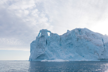 Nature and landscapes of Greenland or Antarctica. Travel on the ship among ices. Studying of a phenomenon of global warming Ices and icebergs of unusual forms and colors Beautiful sunny and cloudy day