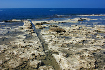 Rocky coast of the blue sea
