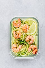 Meal prep lunch box containers Spiralized zucchini noodles pasta with shrimps
