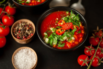 Traditional spanish cold tomato soup gazpacho on concrete background