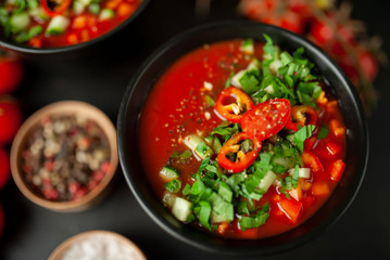 Traditional spanish cold tomato soup gazpacho on concrete background