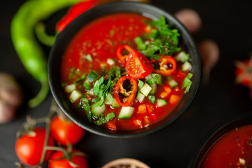 Traditional spanish cold tomato soup gazpacho on concrete background