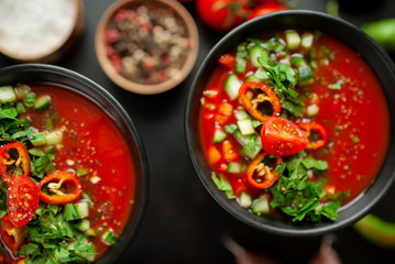 Traditional spanish cold tomato soup gazpacho on concrete background