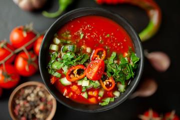 Traditional spanish cold tomato soup gazpacho on concrete background