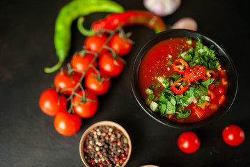 Traditional spanish cold tomato soup gazpacho on concrete background
