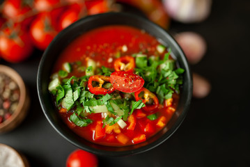 Traditional spanish cold tomato soup gazpacho on concrete background
