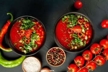 Traditional spanish cold tomato soup gazpacho on concrete background