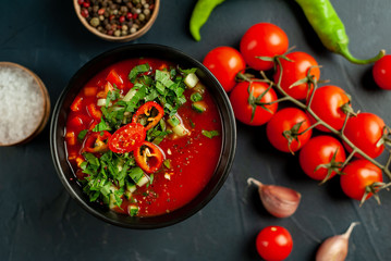 Traditional spanish cold tomato soup gazpacho on concrete background