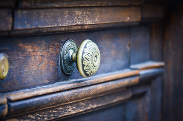 old ancient doors from wood and designed knobs