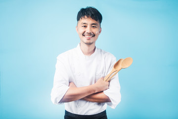 An Asian male chef，Gray background