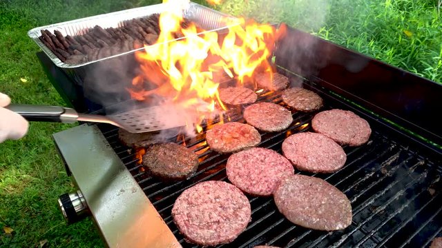 Grilling hamburgers on a big barbeque BBQ