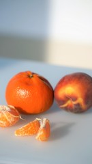 Close up view on whole mandarines and slices and peel