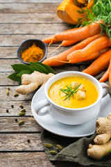 Seasonal spicy fall autumn creamy pumpkin and carrot soup