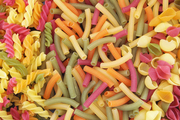 Assortment of colorful pasta or macaroni as background
