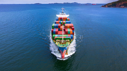 Aerial view container ship carrying container in import export business logistic and transportation...